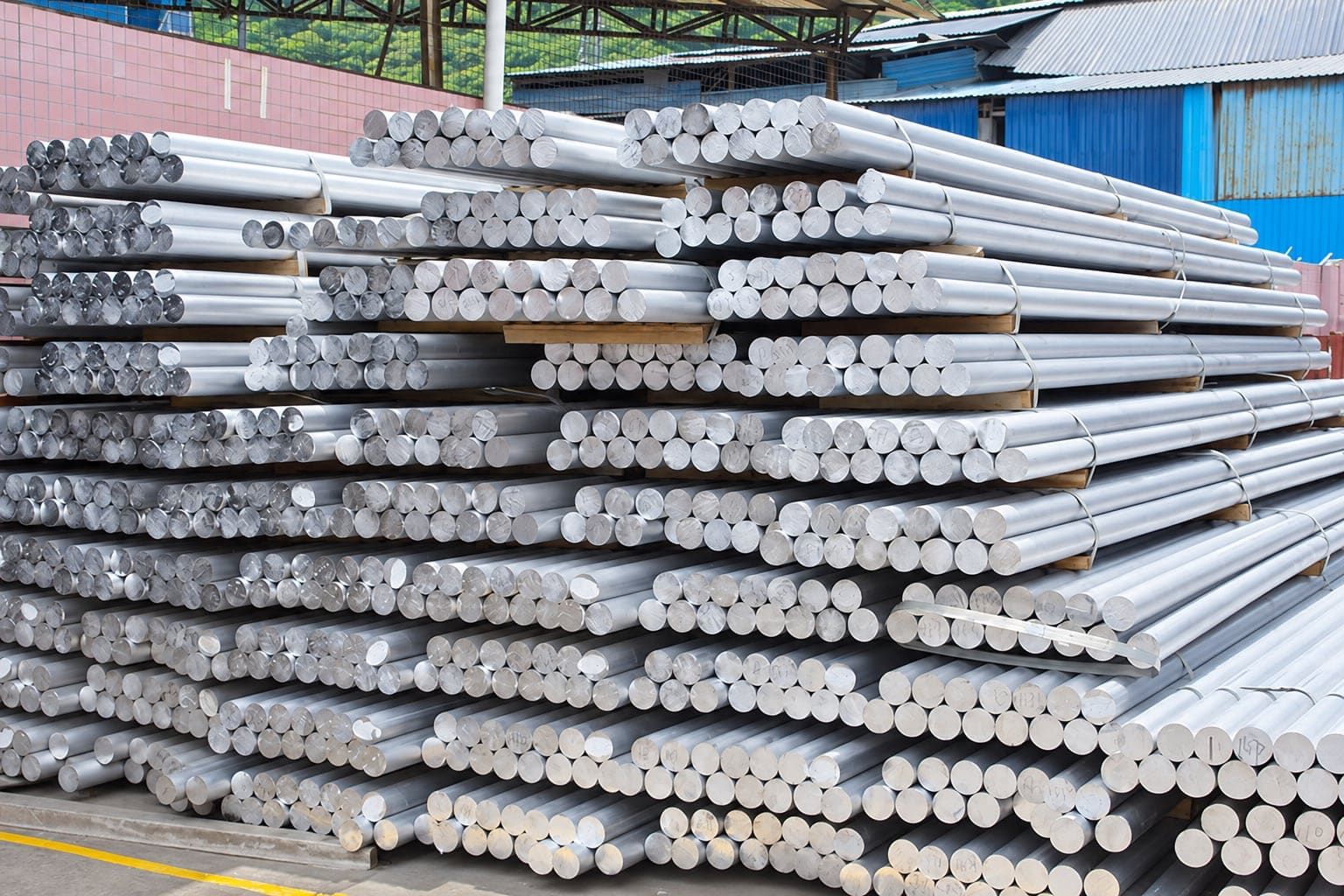 Stacks of aluminum extrusion billets in stock at the plant