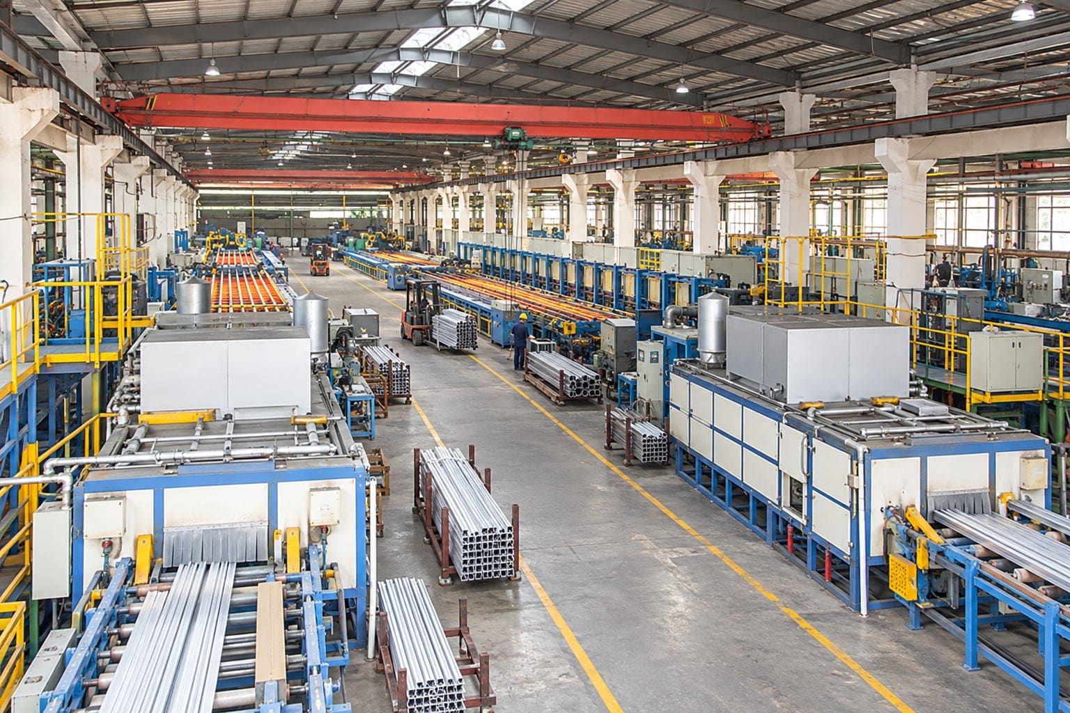 Production hall at the CharMax Aluminum extrusion plant in Tangxia, Dongguan, with aging ovens and extrusion lines